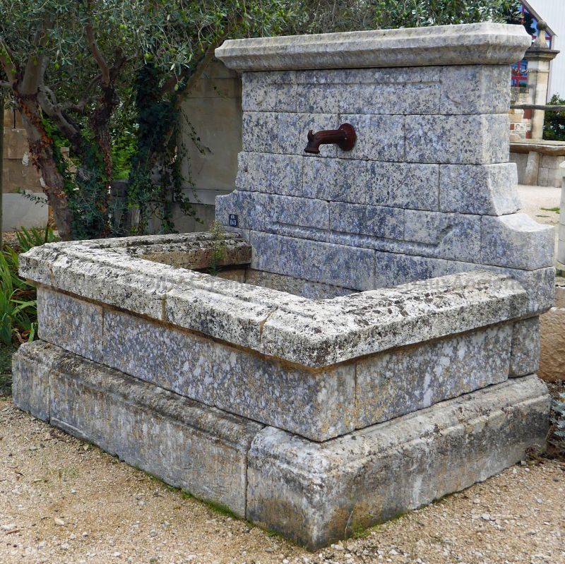 Garden wall fountain in old stone by Alain BIDAL Antique Materials in Provence