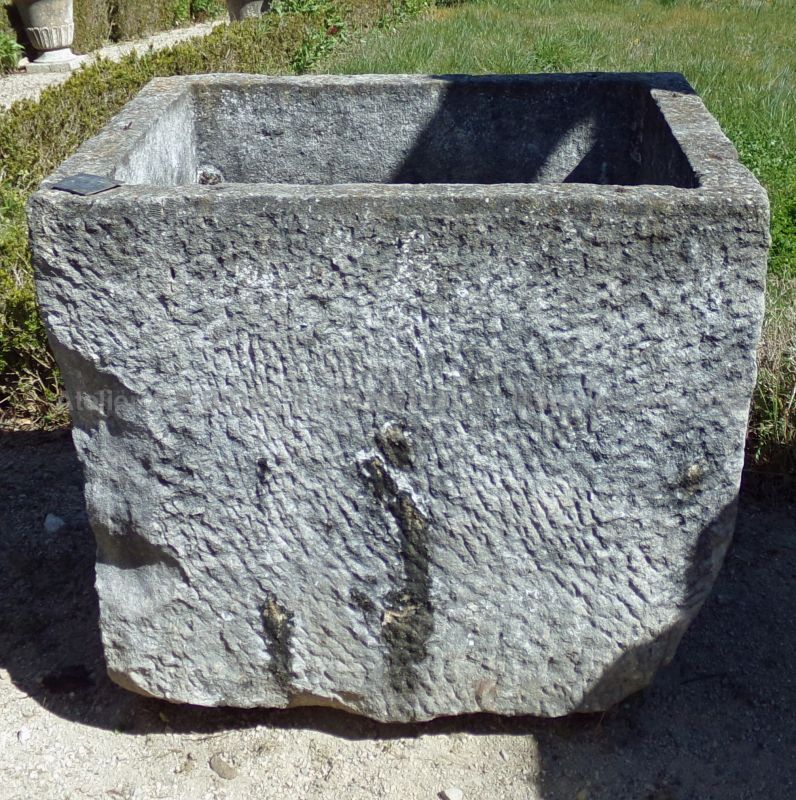 Antique rectangular trough with a rustic appearance