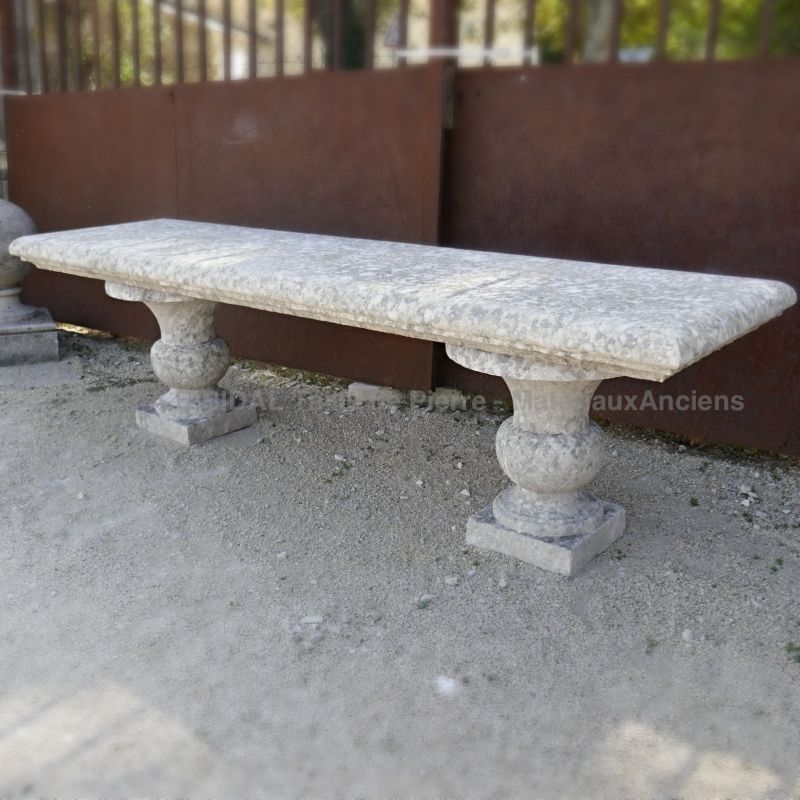 Antique garden furniture in stone by Atelier Alain Bidal in Provence.