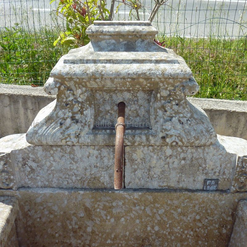 Beautiful outdoor fountain with basin - A beautiful wall fountain more in width than in height.