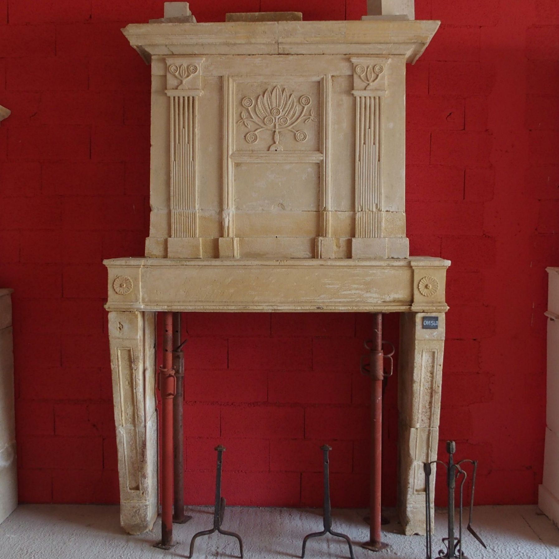 Louis XVI fireplace - a fireplace with overmantl made of Charentes natural stone.
