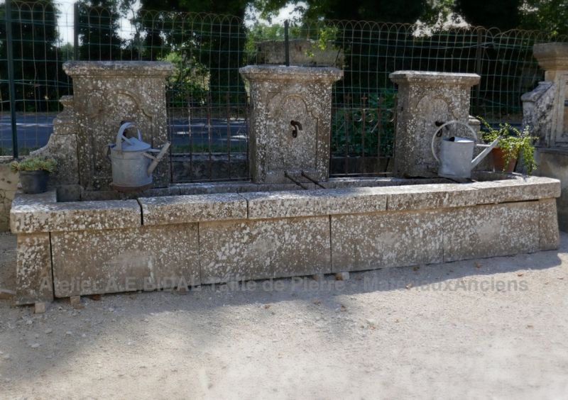 Large fountain of Provence in old stones and wrought iron | Antique garden fountain.