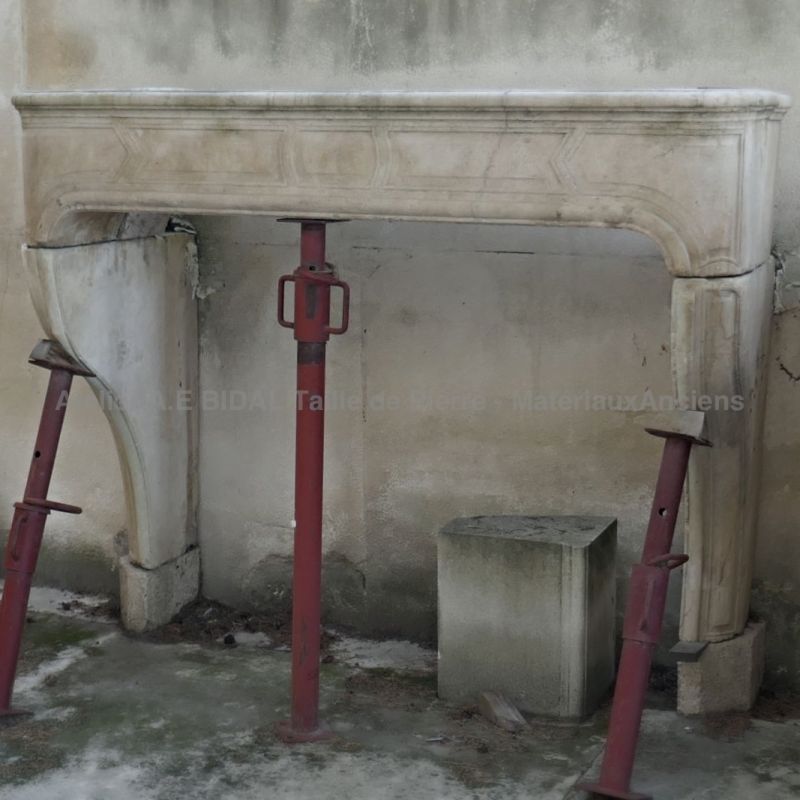 French Louis XV mantle carved in stone for an elegant decoration of the house.