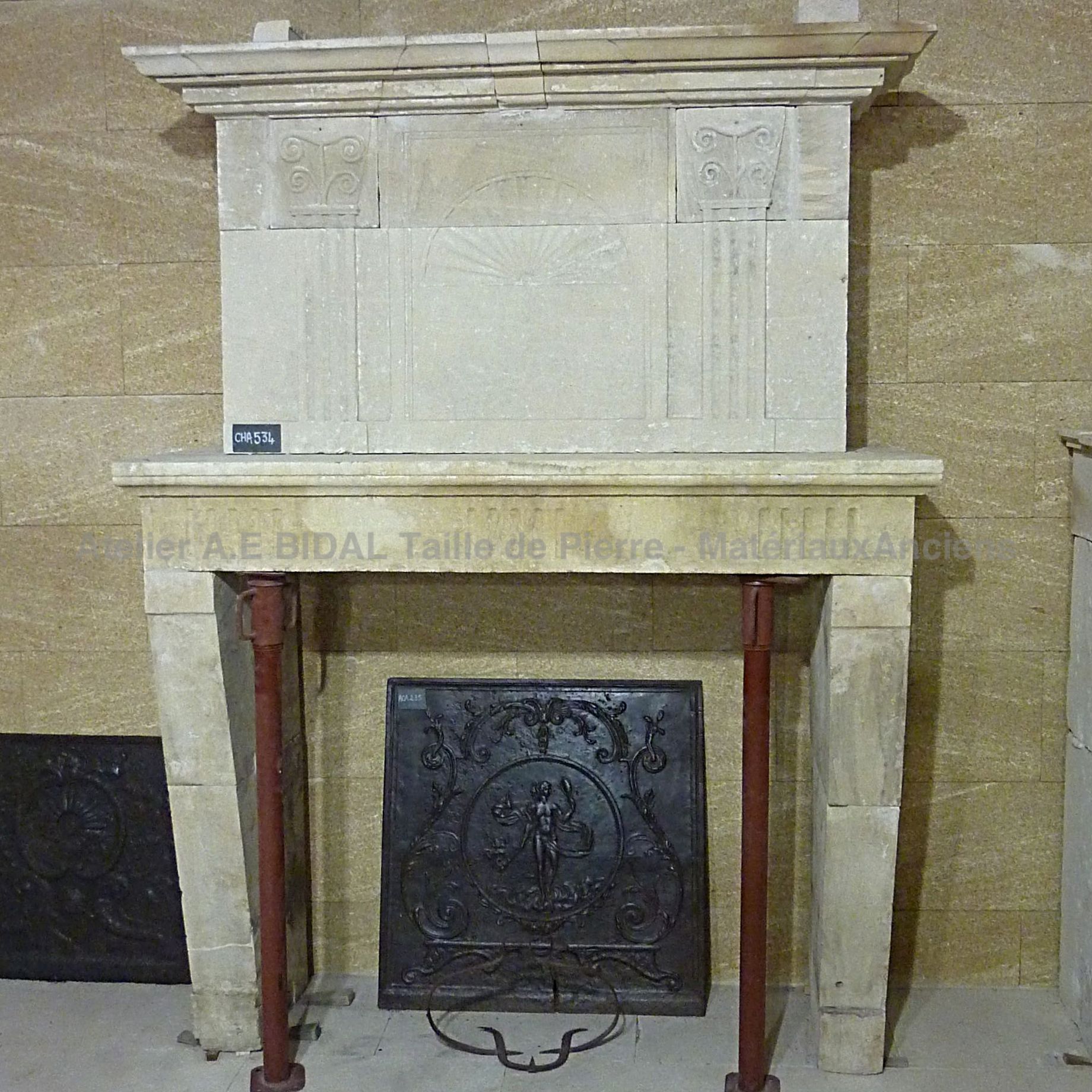 Antique Louis 16 fireplace in stone - Beautiful stone fireplace with sculpted hood.