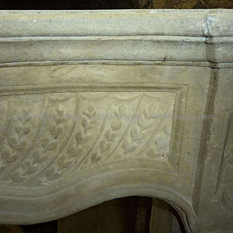 Antique fireplace in stone made during the Louis XV reign.