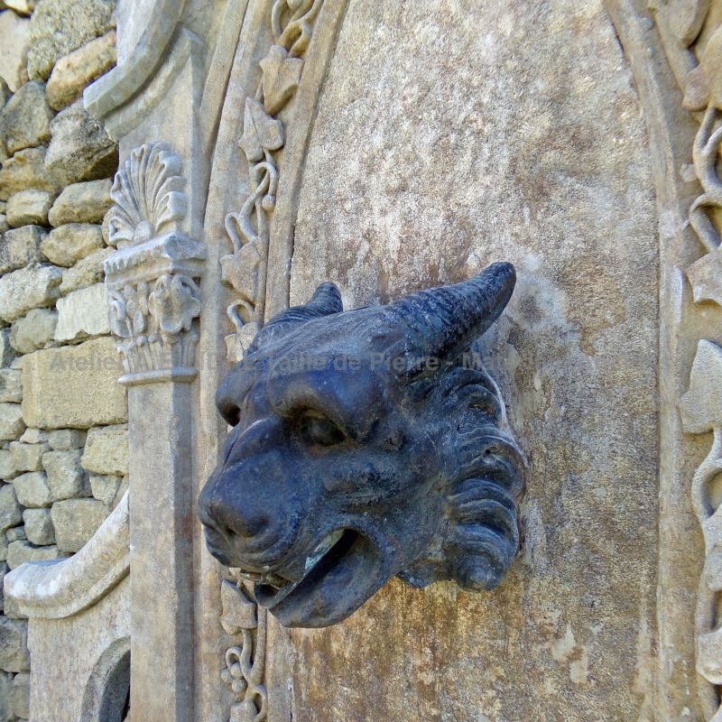 Antique cast iron ram's head on our Gothic stone fountain - Atelier Alain BIDAL (Provence)