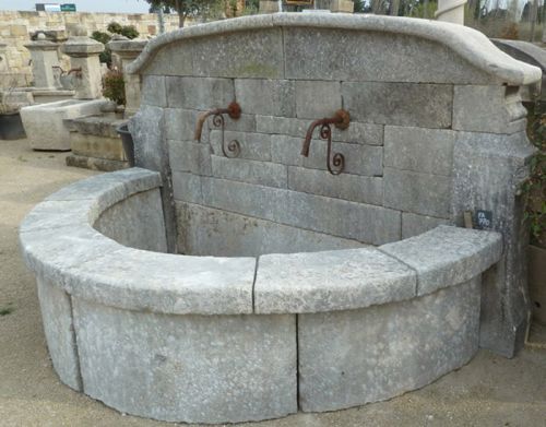 Outdoor fountain with basin - a wall fountain made entirely of authentic stone, cold Bourgogne stone.