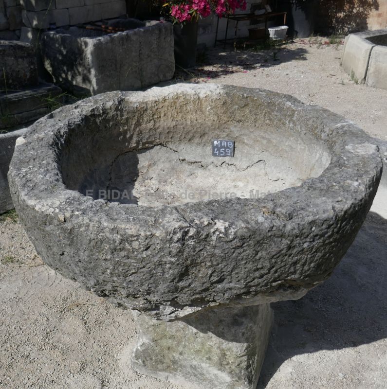 Large antique circular shallow stone trough for sale at Alain BIDAL Antique Materials in Provence.