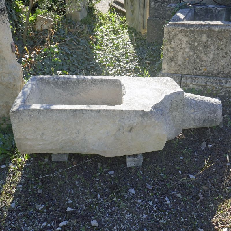 Massive through with spillway in stone : a robust and ecological planter for sale at Atelier Alain BIDAL (Provence)
