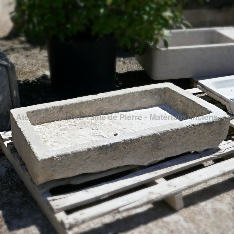 Antique stone sinks on sale at Alain Bidal's workshop in Provence like this old pile of Provence in stone.