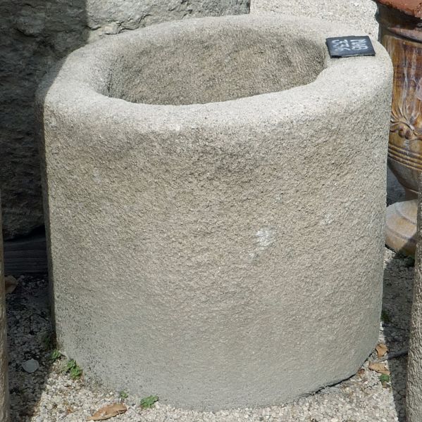 Beautiful circular trough made of authentic stone - flowerpot.