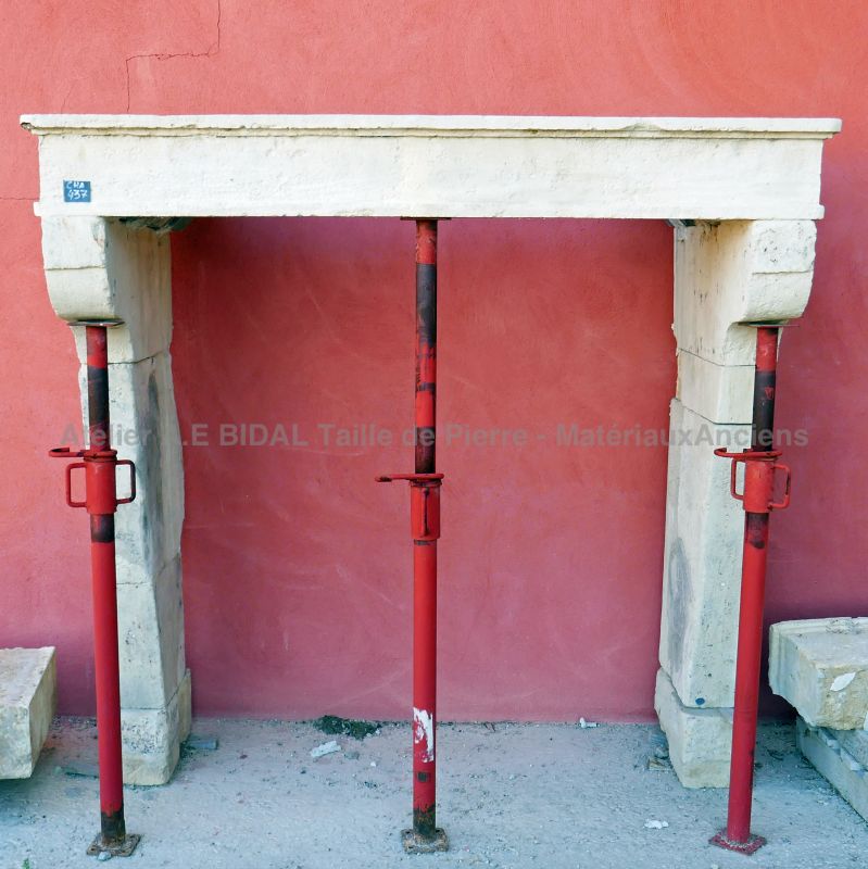 Small Louis 14 fireplace in white stone- A small rustic fireplace in natural stone.