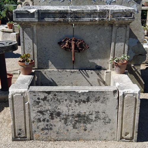 Beautiful wall fountain in an old fashionned style with a rural charm - French made garden fountain.