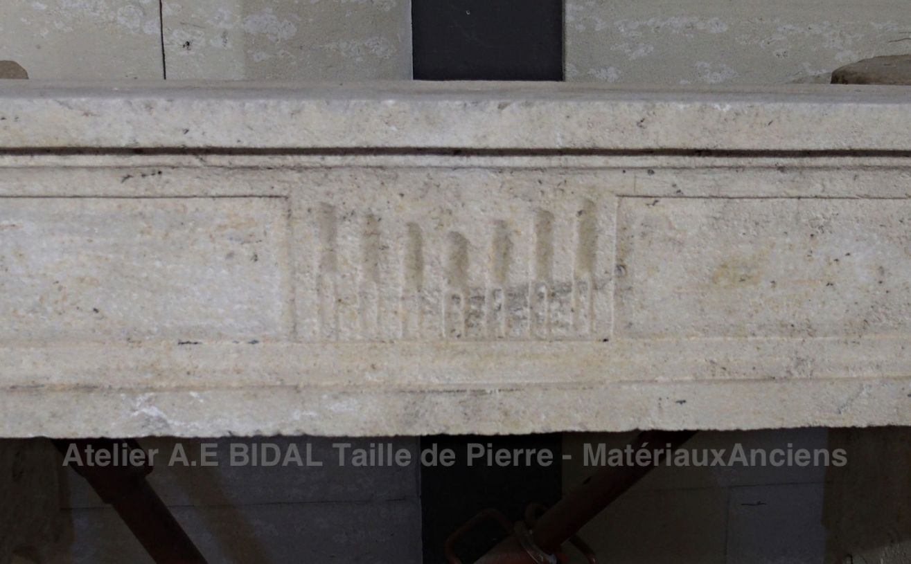 Old stone fireplace decorated in 18th century fashion - Louis 16 fireplace.