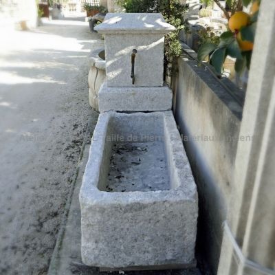 Beautiful stone fountain for a rustic-style landscaping from Provence