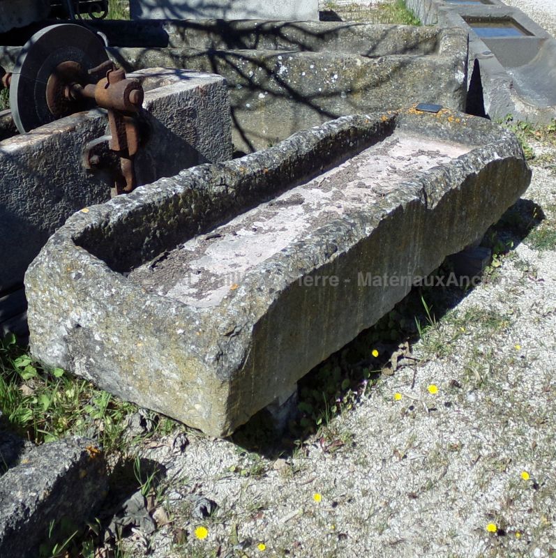Long antique stone trough for sale at Alain Bidal Antique Materials in Provence