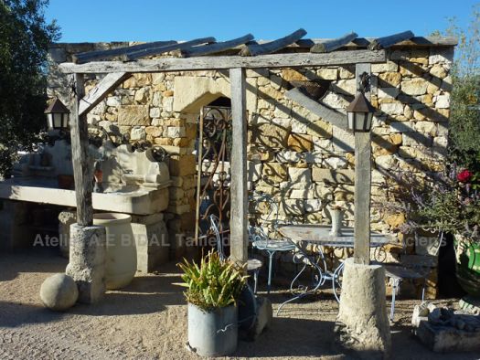 Arbours in old materials: superb garden arbor in wood and stone.
