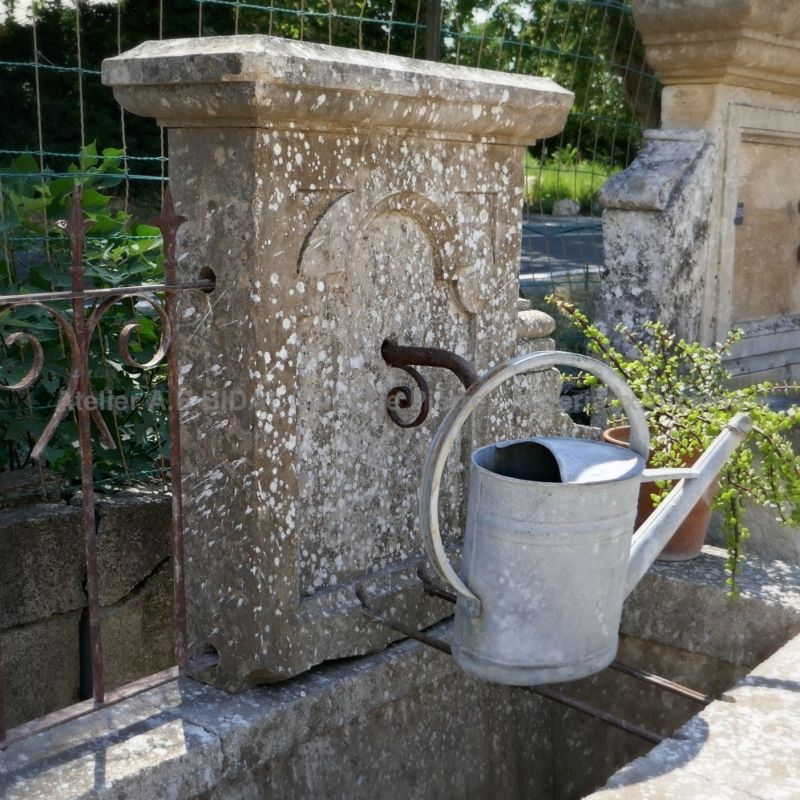 Antique garden fountain in stone for sale in Provence at Atelier Alain BIDAL.