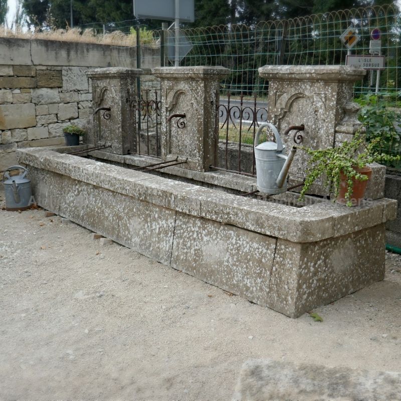 Antique garden fountain in stone and wrought iron for sale in Provence at Alain Bidal Antique Materials.