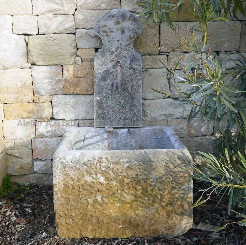 Old stone fountain with massive trough and narrow pediment : Atelier Alain BIDAL (Provence)