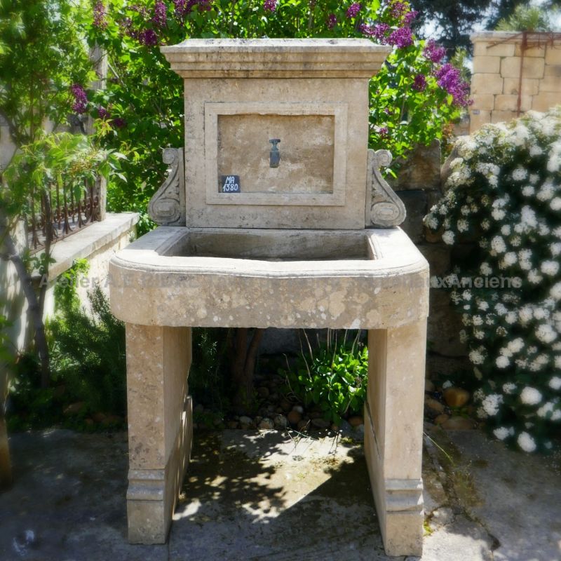 Beautiful stone sink with beautifully decorated pediment | An old sink-type outdoor sink for summer kitchen.