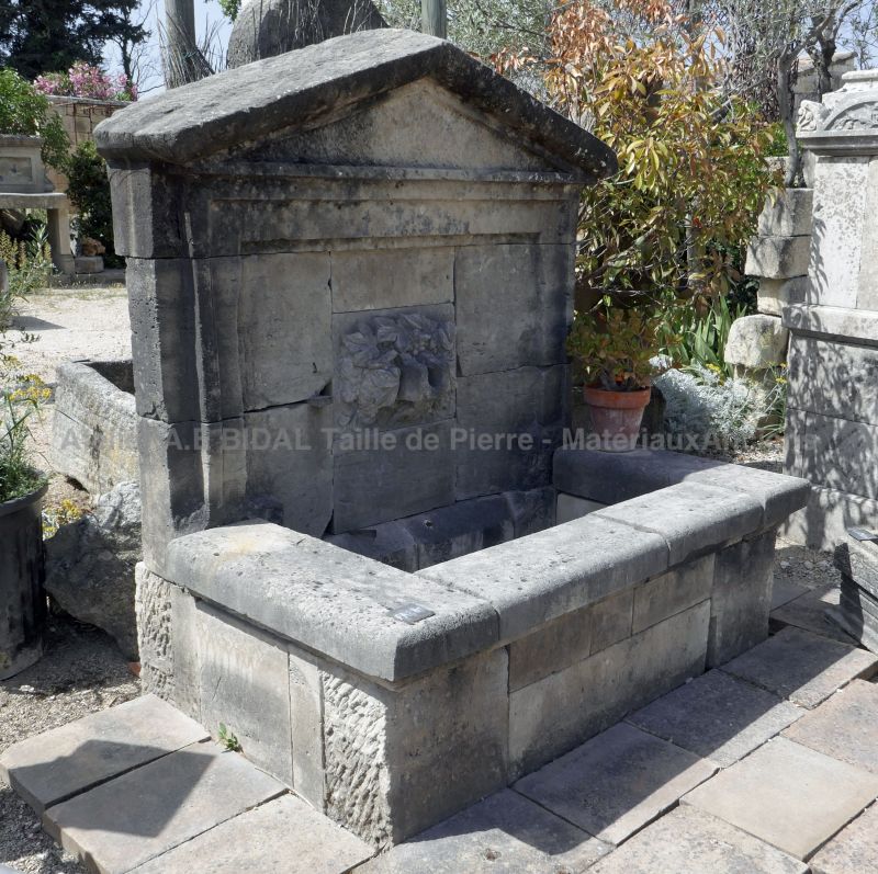 Stone wall fountain | Large Provencal fountain for garden to discover at the stonemason BIDAL.