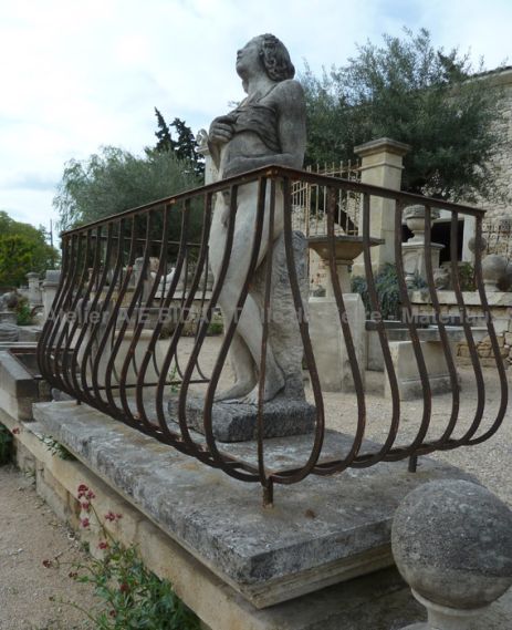 Stone balcony with wrought iron balcony rfence.