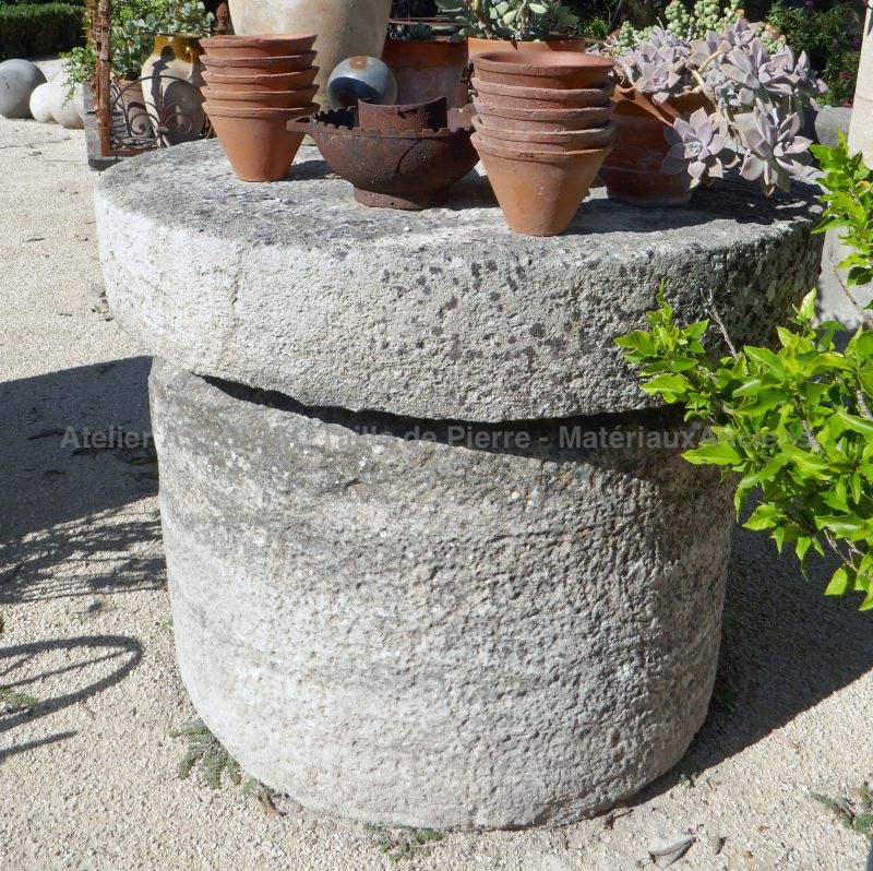 Old grinding wheels in stone for sale at The Antique Materials in Provence Alain BIDAL