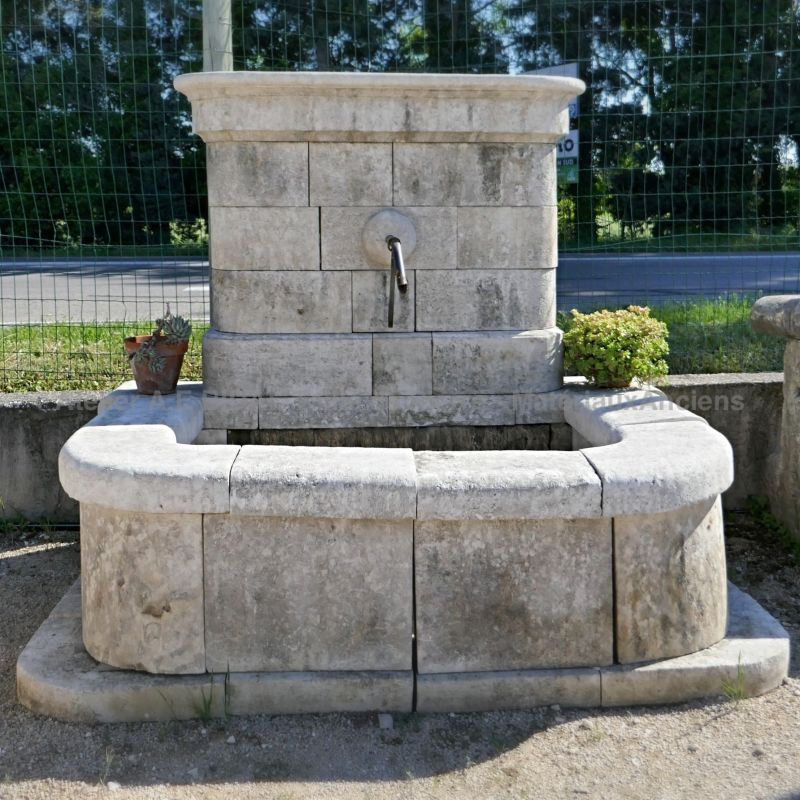 Outdoor fountain in stone with rectangular basin and pediment | Wall fountain for an elegant decoration of the garden.