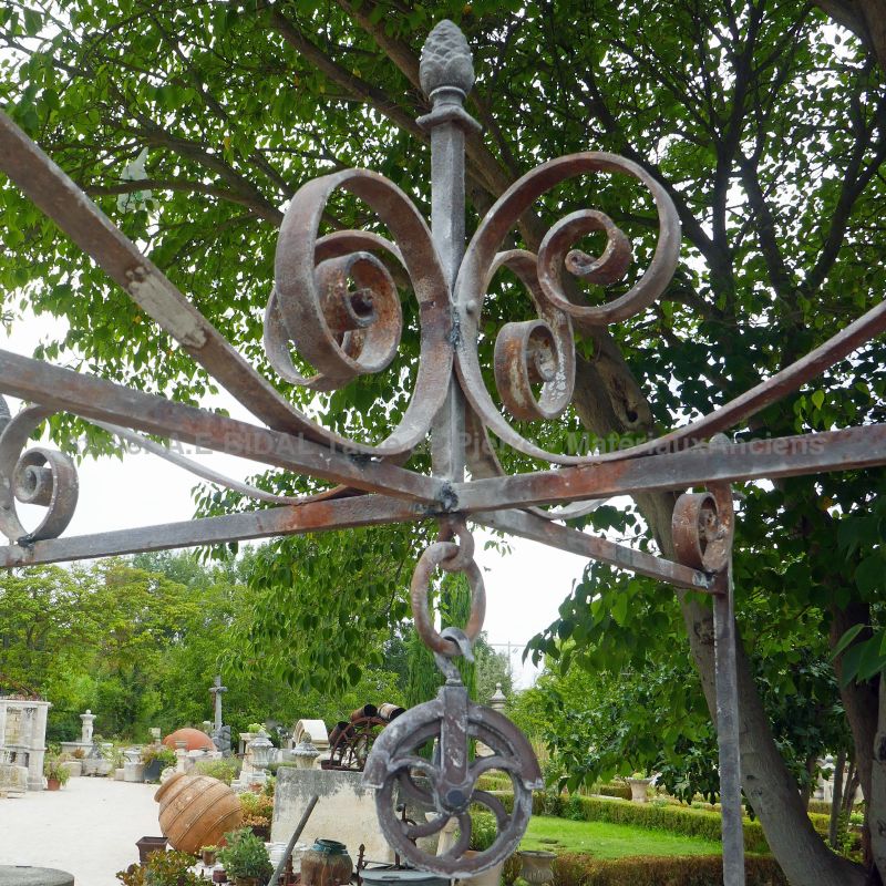 Detail of the hand-forged ironwork on the top of our square stone well - Atelier Alain BIDAL