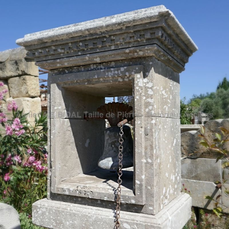 Beautiful garden ornament in ancient materials : pillar and bell.