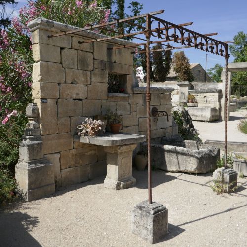 Beautiful wall fountain can be used for the development of a living area next to a pool.