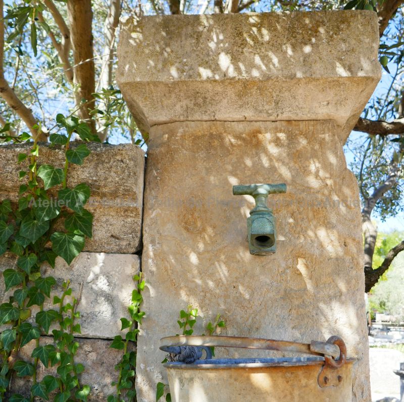 Detail of the stone pediment on our garden fountain with old trough | Decorative fountain for sale in Provence at Bidal's.