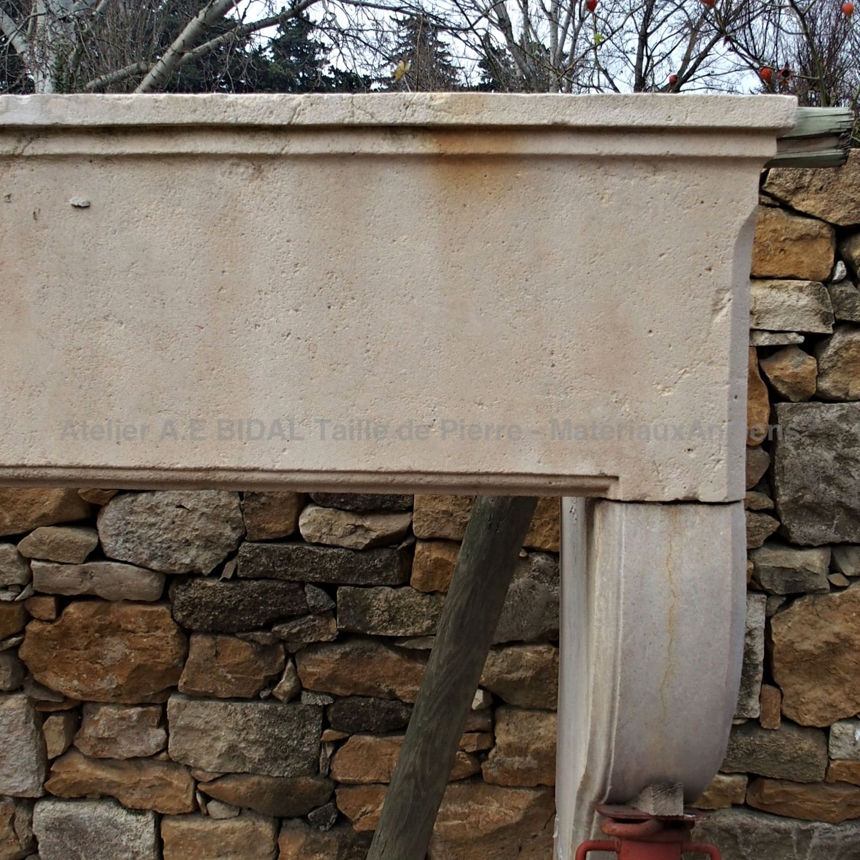 Large old stone fireplace - old fireplace in regional style.
