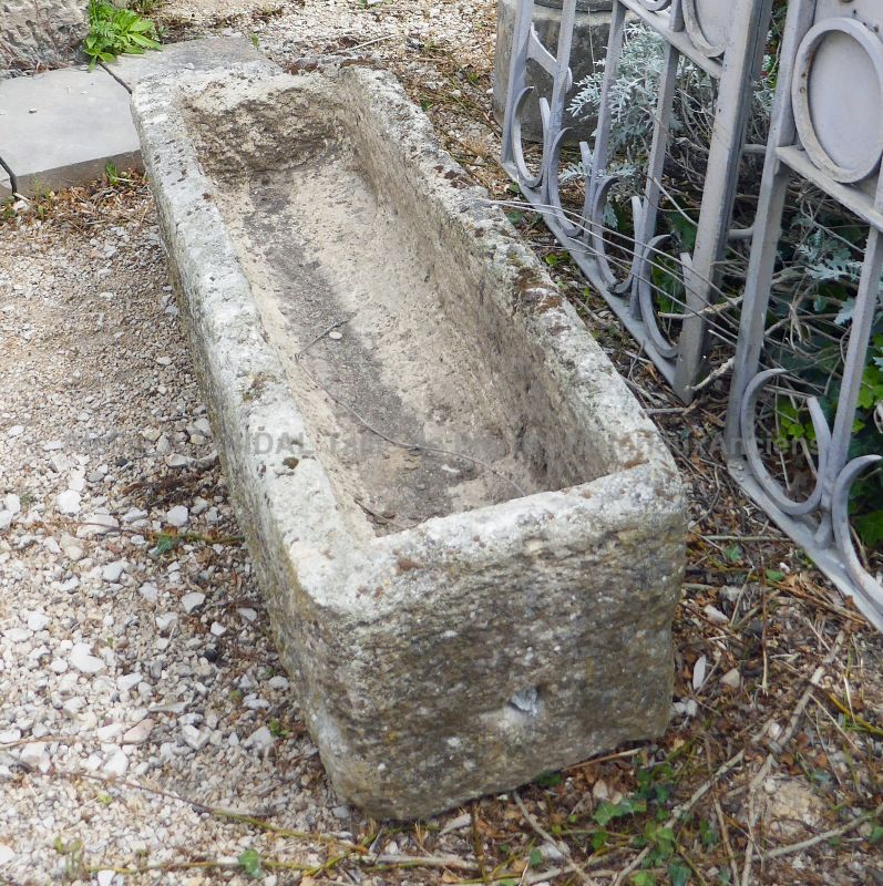 Old stone trough for sale at Atelier Alain BIDAL in Provence.