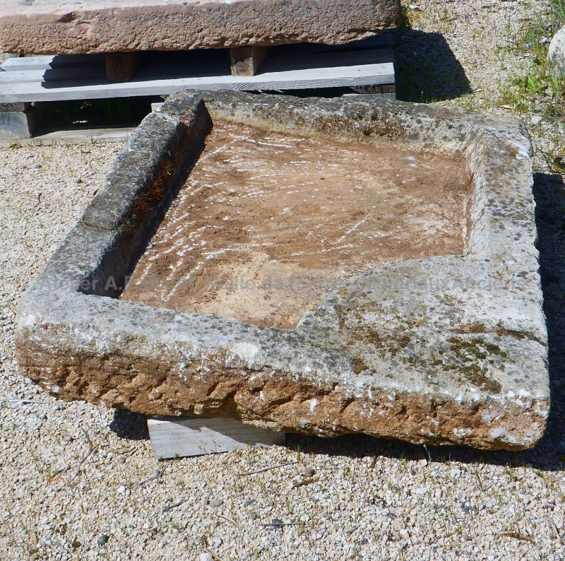 Old Provencal stone sink : a shallow monolithic rustic sink in stone