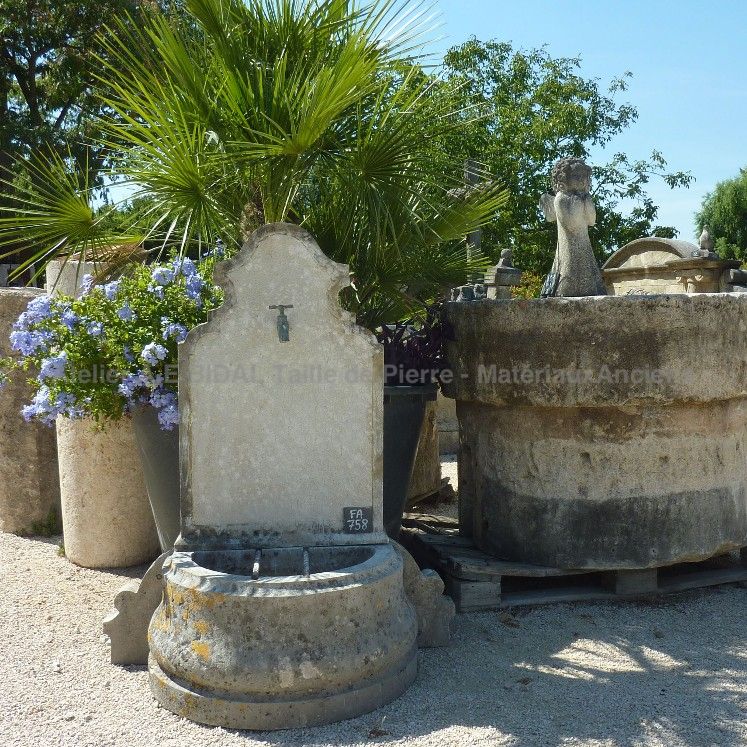 Water point in a wall fountain style that would be perfect to decorate a water point in a modest sized outdoor space.