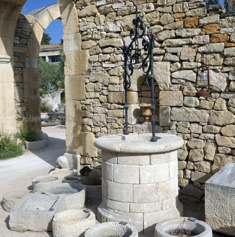 Beautiful old well made of paired stones -  Garden well in stone by Alain BIDAL