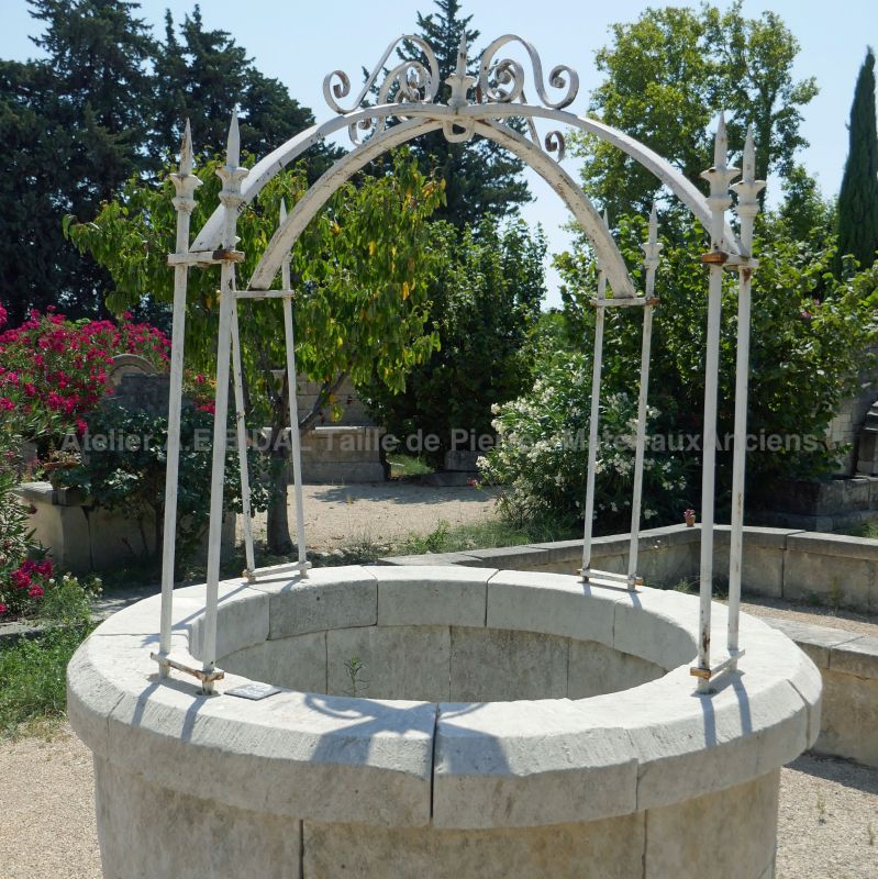Garden well with its wrought-iron top by the Antique Materials In Provence Alain BIDAL