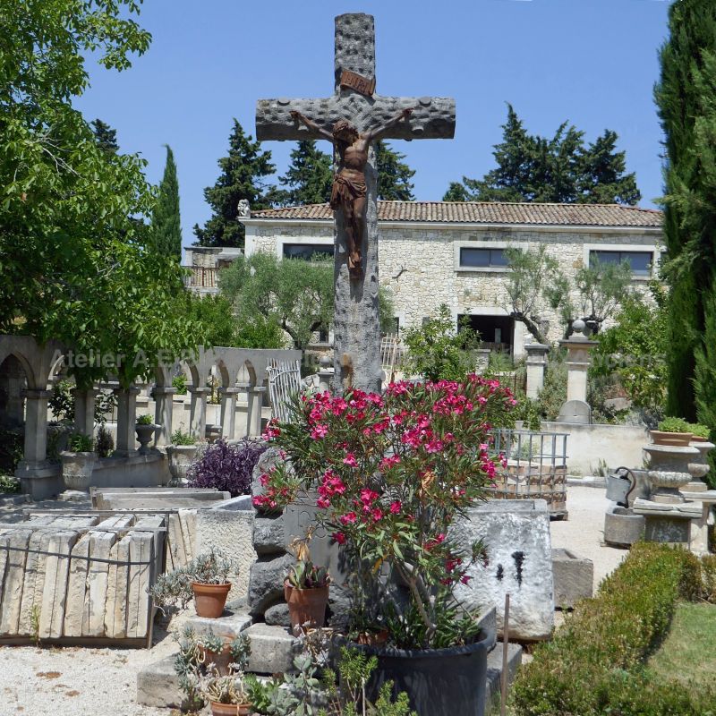 Antique Christian monument : stone cross and Christ made of wrought iron by Atelier Alain BIDAL.