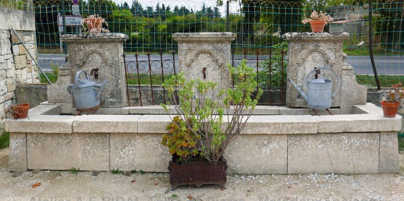 Decorative stone fountain by the artisan stonemason in Provence Alain Bidal.