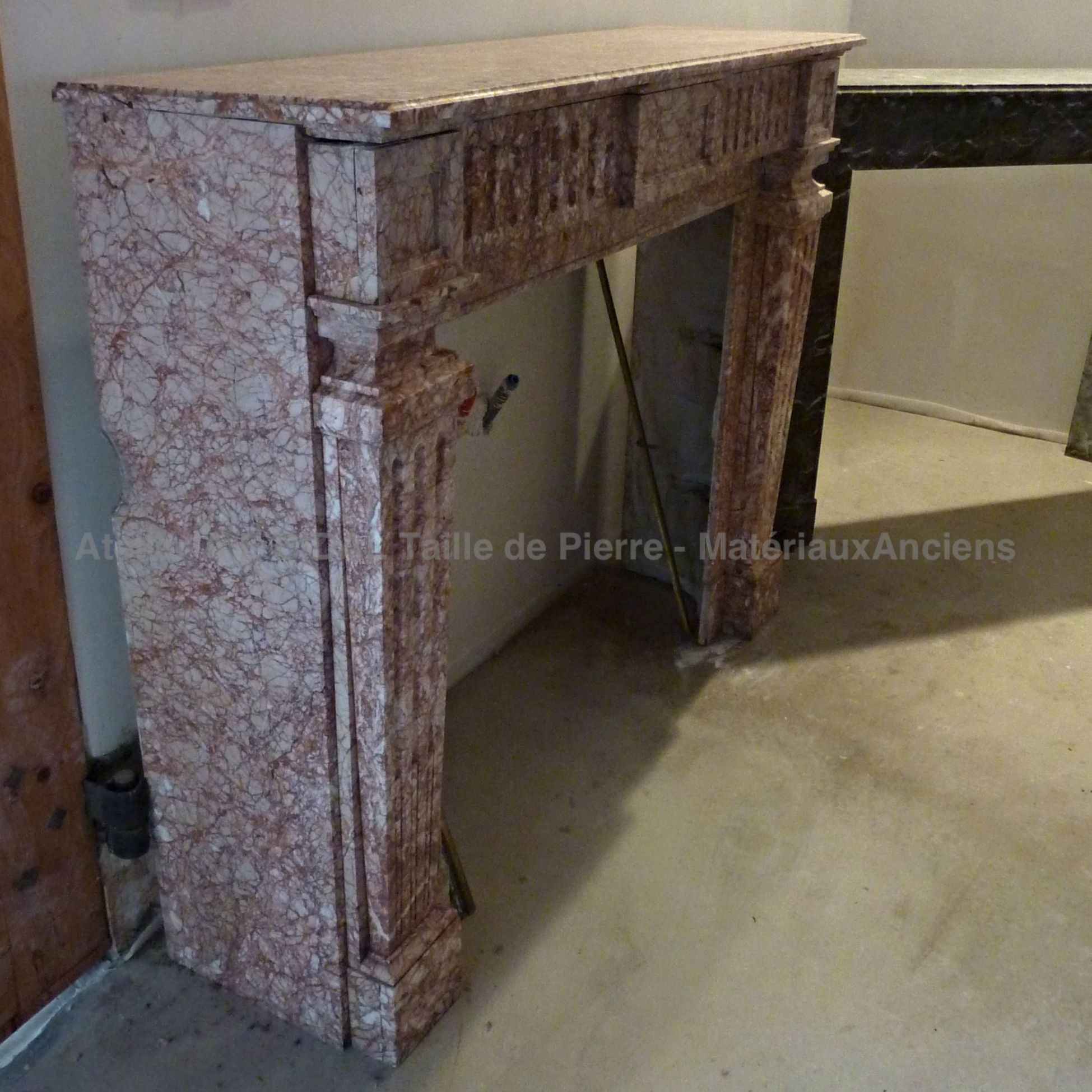 Pink marble fireplace in the Pyrenees - a 19th century fireplace with lots of charm.