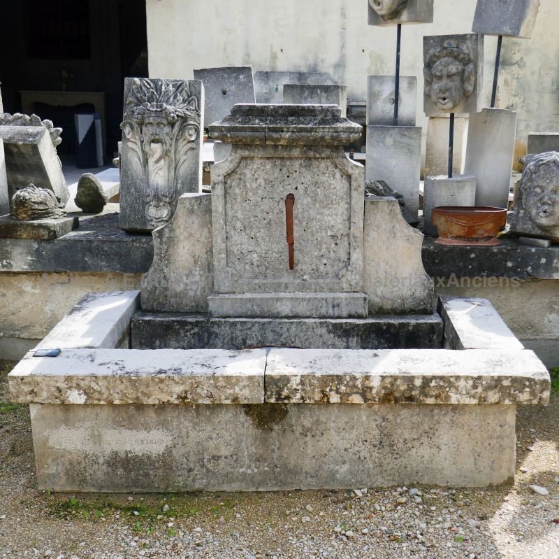 Small fountain in stone : a garden fountain in aged stone by Alain BIDAL Antique Materials in Provence.