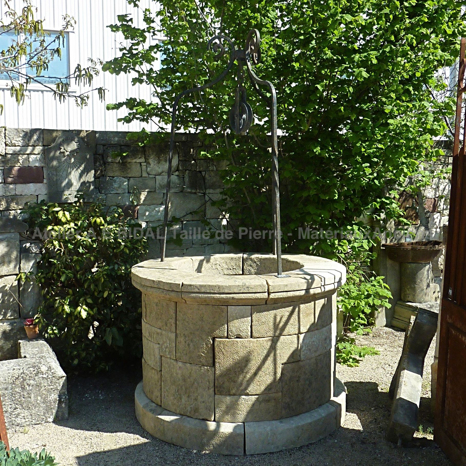 Beautiful circular well for garden - with wrought iron well top.