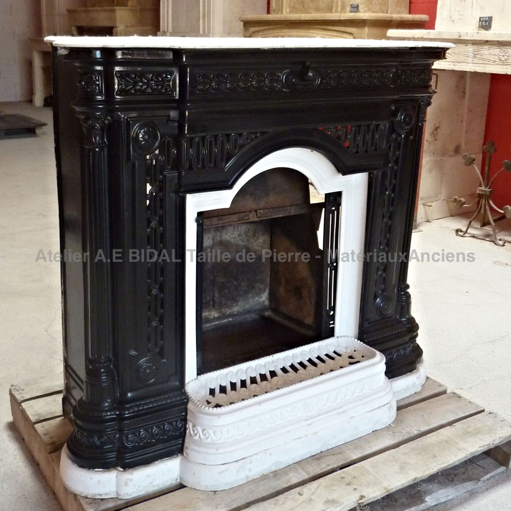 Old fireplace with sliding doors - 19th century fireplace in a black and white colour.