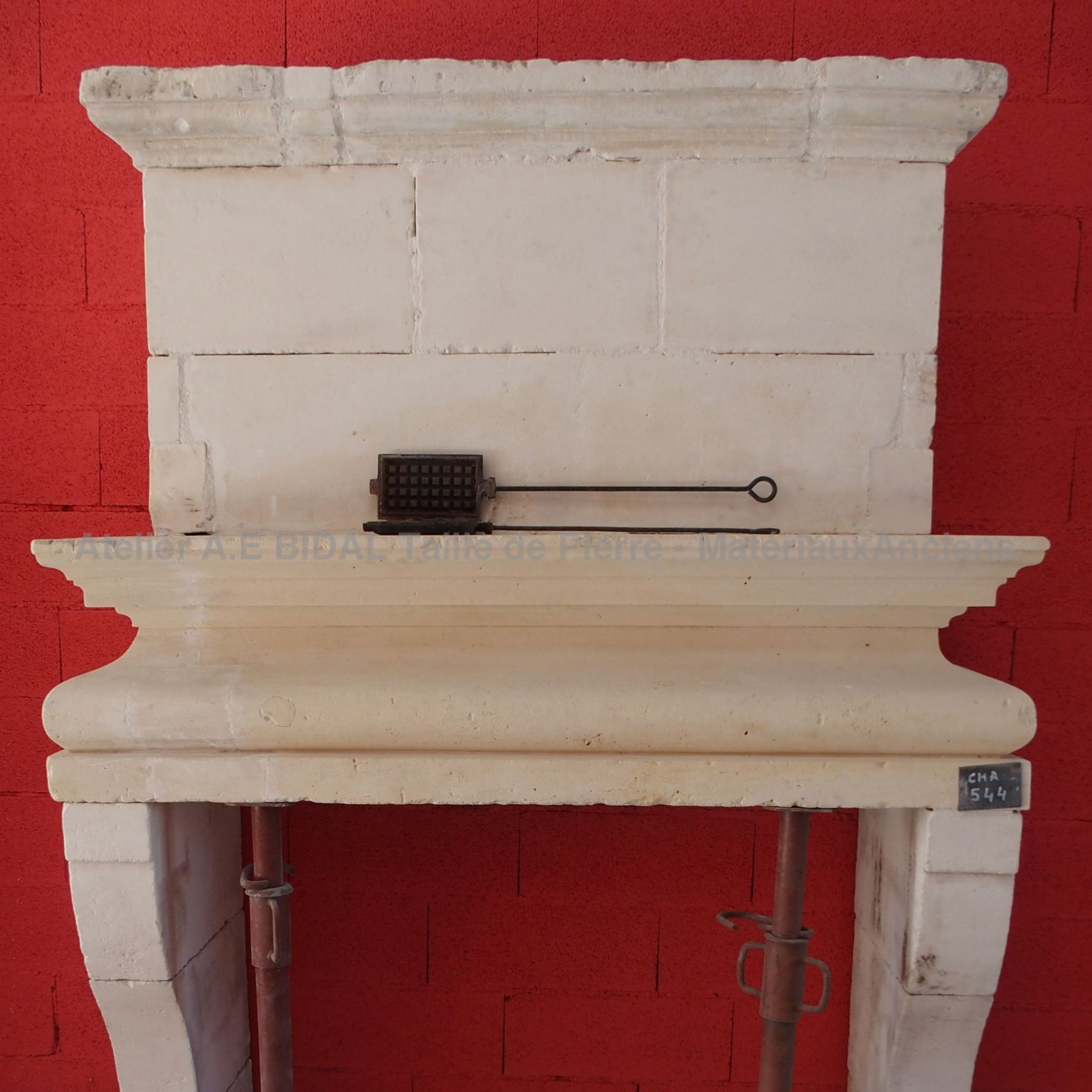 Fireplace made of Provence stone - a Louis XIII fireplace for indoor decoration.