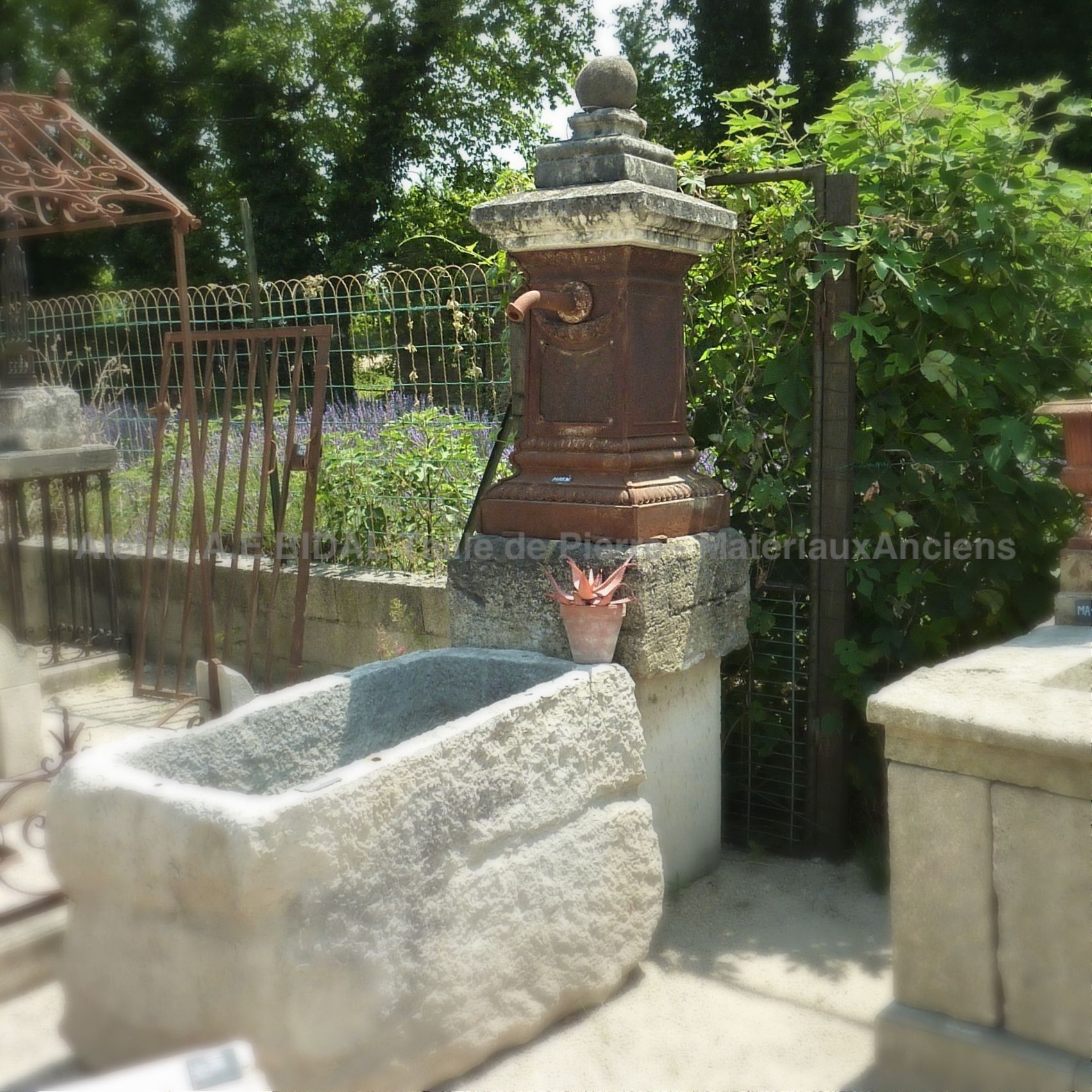 Antique water point with old stone basin.