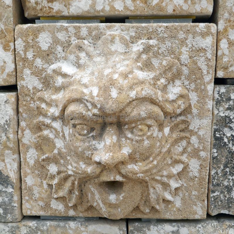Detail of the hand-carved water spout in ancient stone on our large garden wall fountain in paired stones.