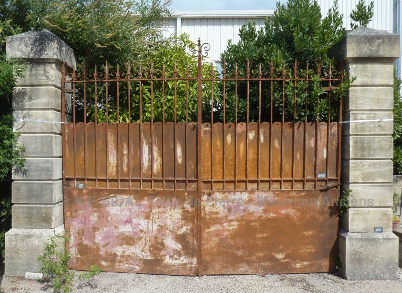 Old gate with authentic naturally weathered look - old gate made of wrought iron .