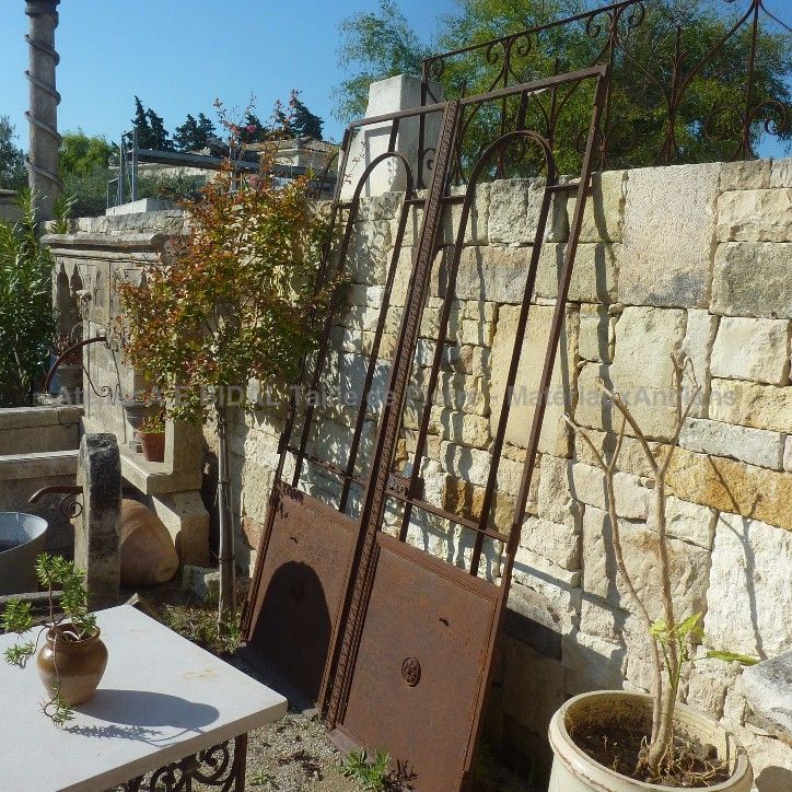 Old door with 2 doors - an old door made of handcrafted wrought iron.